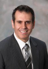 Photo of Joseph Soares - a ,am wearing a suit and tie