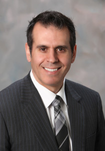 Photo of Joseph Soares - a ,am wearing a suit and tie