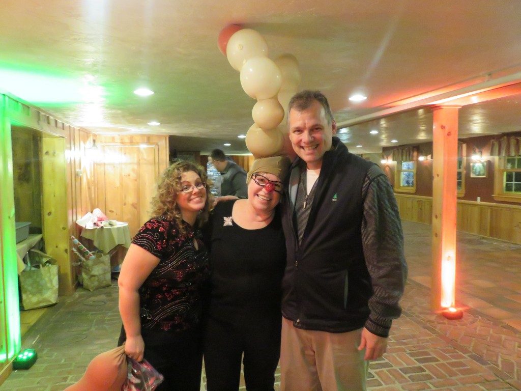 Steve, Jean, Krishna at the company Christmas party.