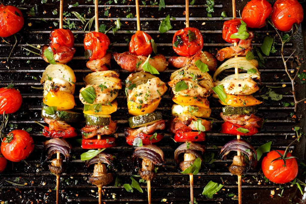 Colorful food cooking on a grill